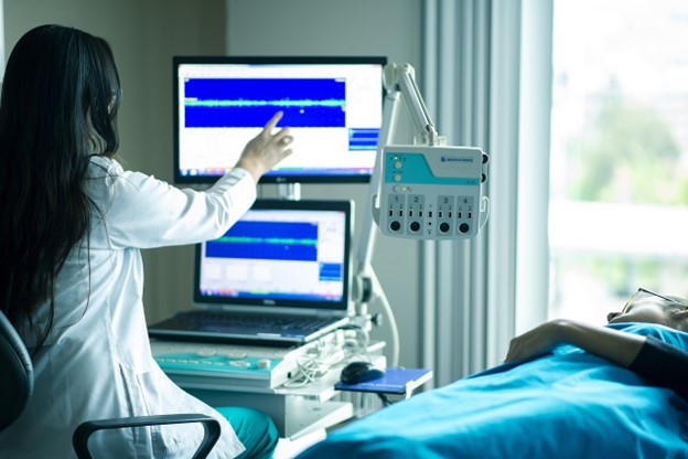 A healthcare worker conducting a medical examination
